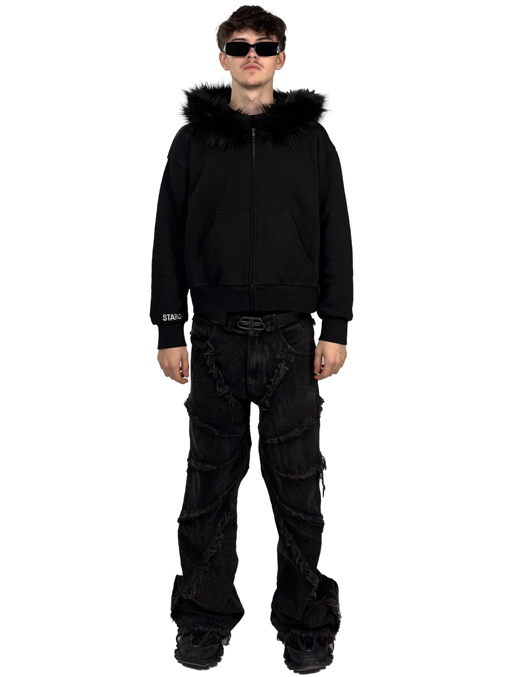 Front view of a model wearing a Starlit black fur hoodie with fur, highlighting the luxurious fur details and contemporary streetwear style.