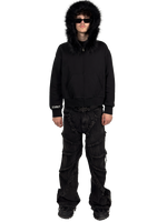 Front view of a model wearing a Starlit fur hoodie with fur and hood on, highlighting the luxurious fur details and contemporary streetwear style.