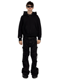 Front view of a model wearing a Starlit fur hoodie without fur, highlighting the luxurious fur details and contemporary streetwear style.