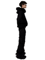 Side view of a model wearing a Starlit fur hoodie with fur, highlighting the luxurious fur details and contemporary streetwear style.