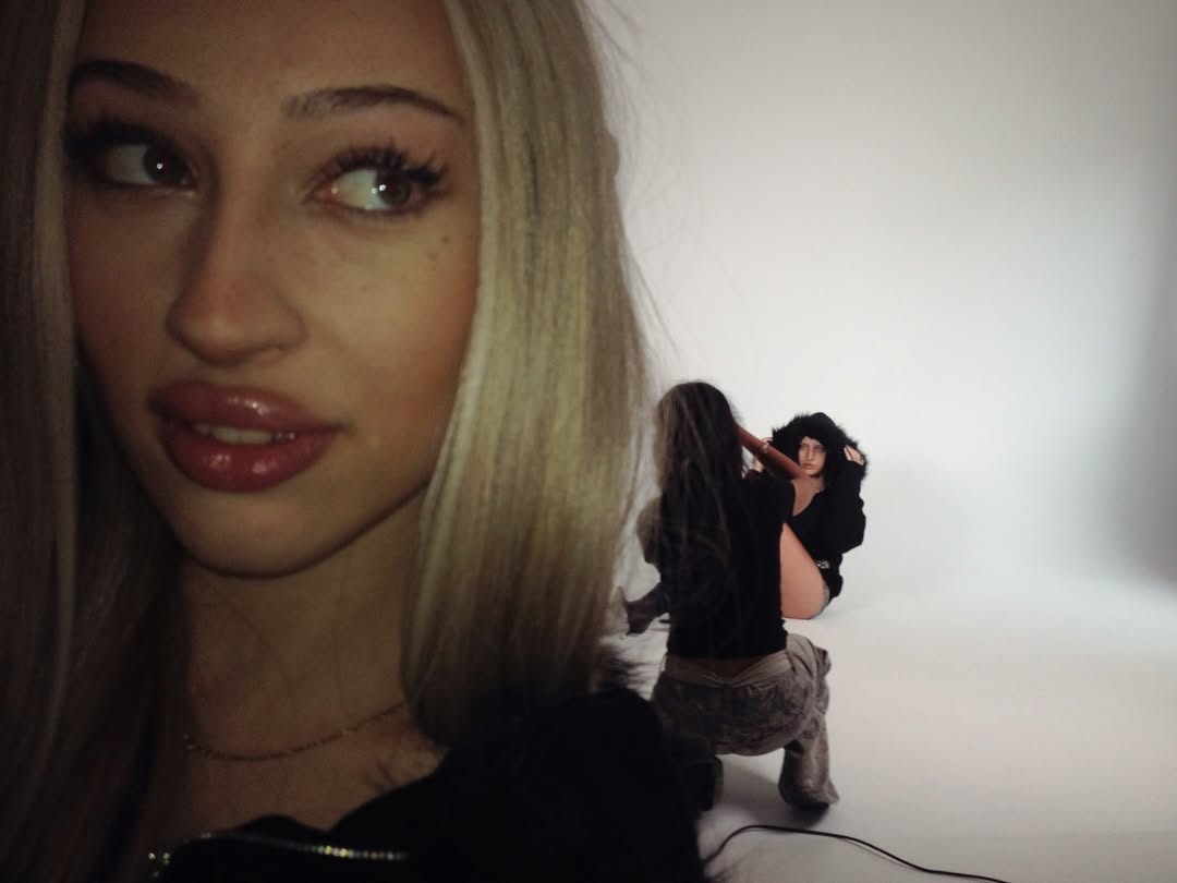 Model in Fur-Zip Hoodie, Sitting in Car, Dark Interior